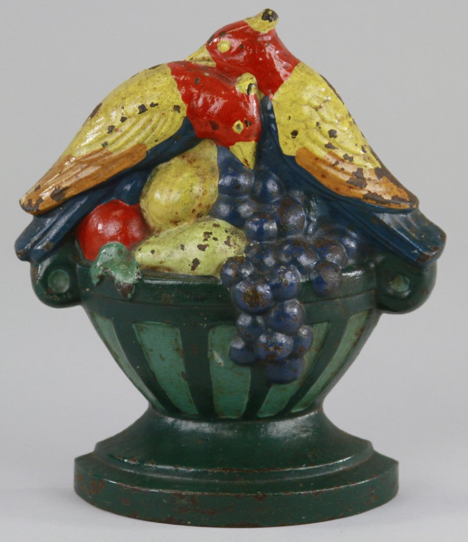 FRUITS & BIRDS DOORSTOP: Marked "COPR 1929 FRUITS AND BIRDS," depicts birds atop a bounty of fruit, strong color. 6 1/2" x 5 1/2".