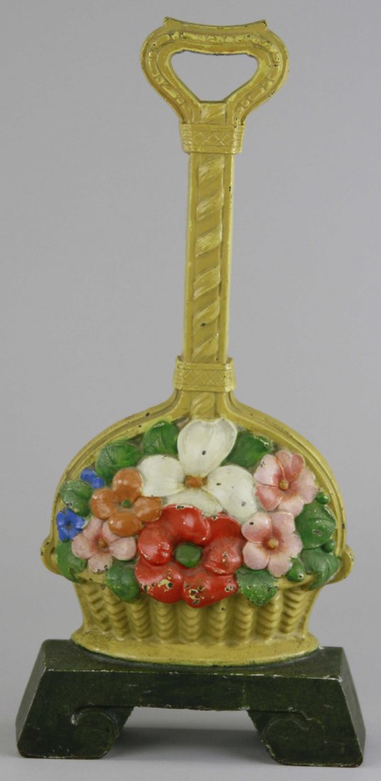 DOGWOOD FLOWER DOORSTOP: Judd Co., marked "1260," very heavy, detailed casting, unique design w/handled basket for easy lifting. BOOK EXAMPLE. 16 1/4" x 7 7/8".