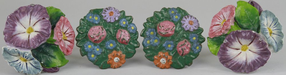 LOT OF TWO SETS OF FLORAL TIEBACKS: Cast iron, includes one pair of Waverly Studios pansy flowers arrangement, marked "WS - Pat Apld for," and one pair of brightly colored flowers w/greenery. 3 1/2" w.