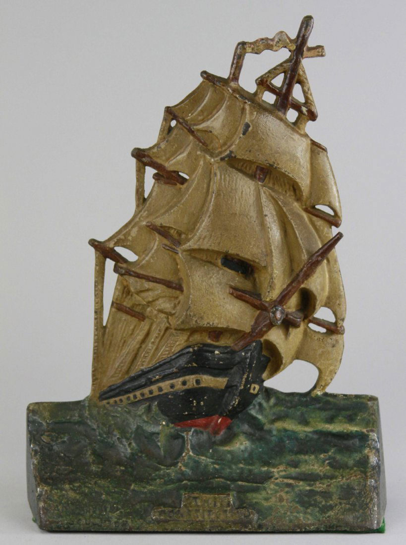 U.S. CONSTITUTION SHIP DOORSTOP: Marked "Copyrighted 1924 AM Greenblatt Studios, Boston Mass," features ship w/full sails on a stormy sea. Front marked "The Constitution" with sculptor's name. 11 1/2" x 8 1/2".