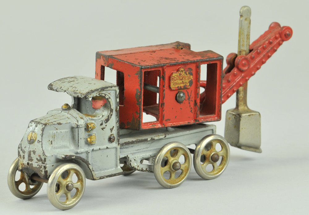 HUBLEY GENERAL DIGGER ON MACK CHASSIS: Early version w/nickel plated spoke wheels, cast iron, painted in grey Mack cab w/red shovel body, nickel shovel and wheels, integral cast driver and worker on body. 10" l.