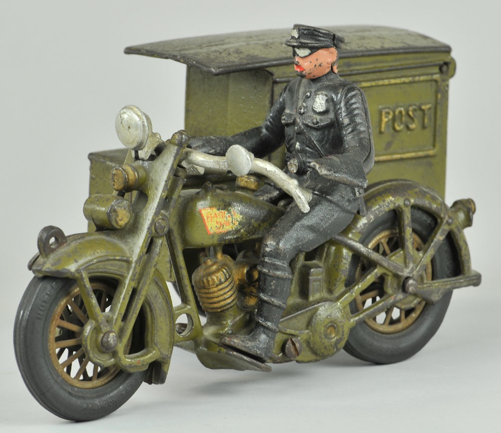 HUBLEY PARCEL POST CYCLE: c. 1930's, cast iron, two cylinder Harley Davidson, painted in olive green, van body side car has opening rear door, features an exhaust clicker, nickel spoke wheels with black rubber tires, aluminum 