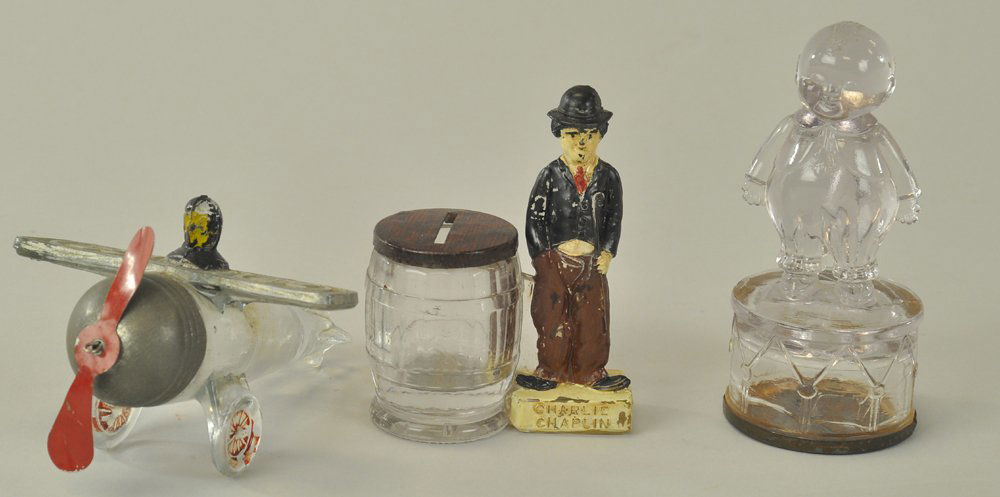 GROUPING OF GLASS CANDY CONTAINERS: Lot includes: Spirit of St. Louis Airplane, Charlie Chaplin with Barrel, and Happy Fats on Drum. 2 1/2" - 4 3/4" h.