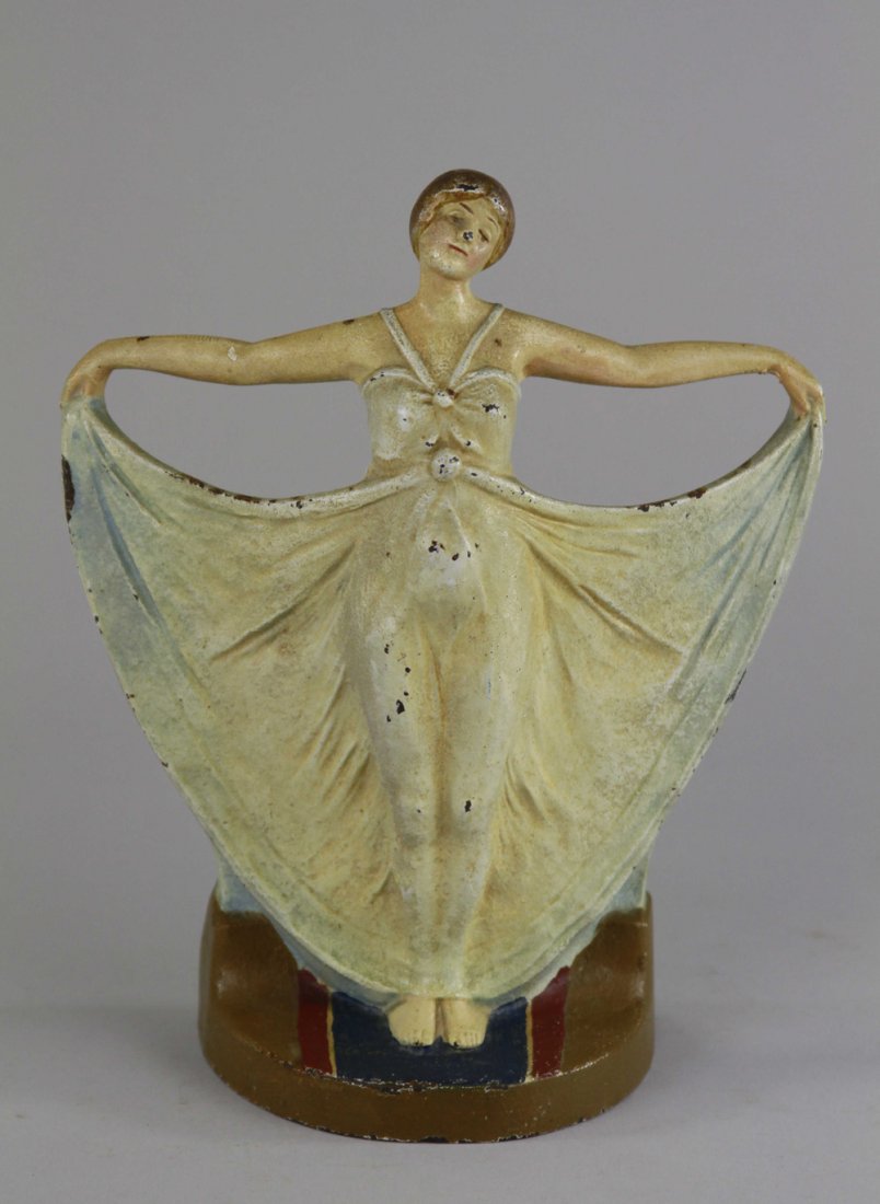 DECO GIRL DOORSTOP: Judd Co., "1251," cast iron, great form depicts woman with out stretched arms in sheer gown. 9 1/4" x 7 1/2".
