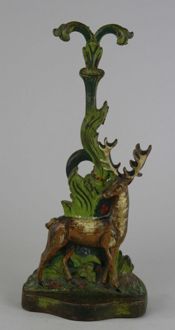 ELK W/FILIGREE PORTER DOORSTOP: Depicts elk in modern style foliage, beautiful form with filigree porter (carry handle). 15 3/4" x 7".