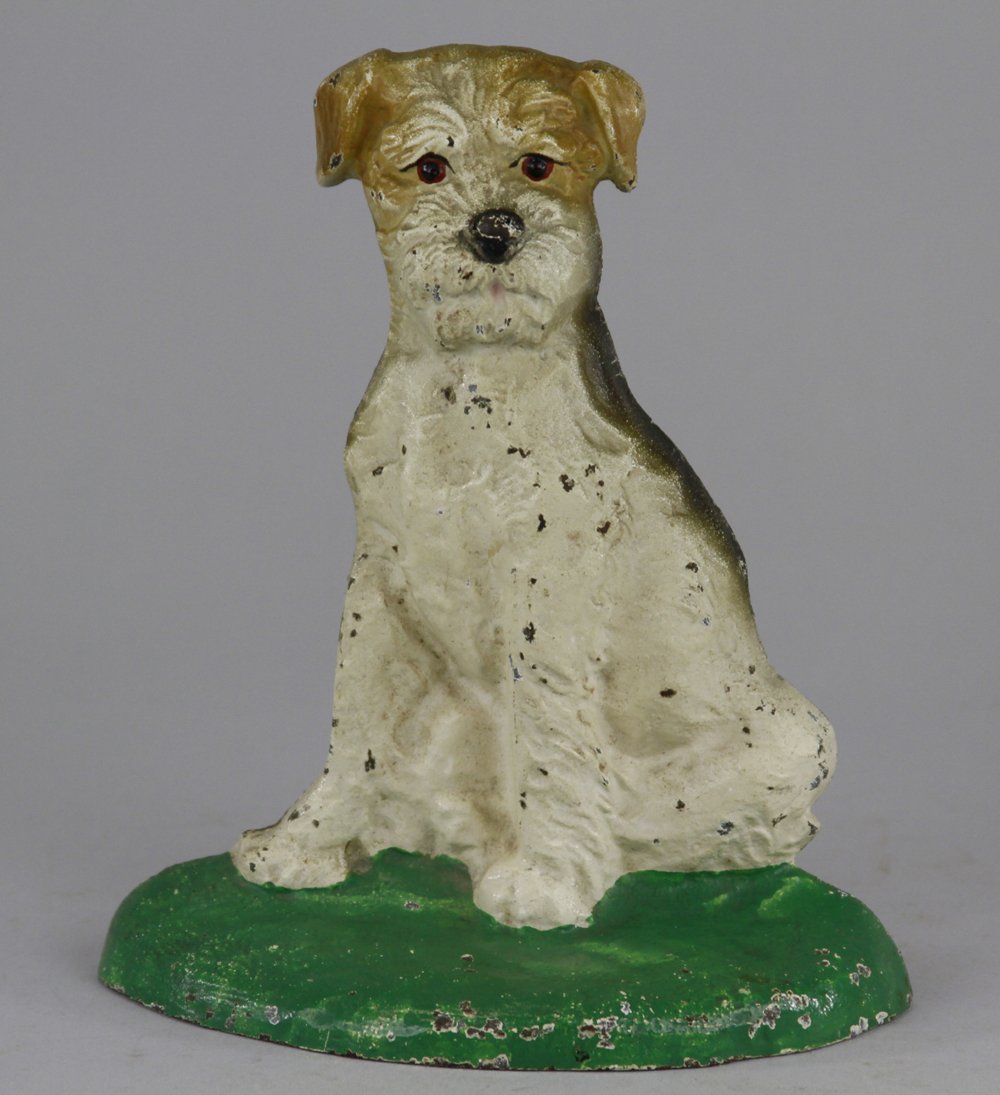 WIREHAIRED FOX TERRIER DOORSTOP: Hubley, "468," cast iron, flat back example, sits on green base, inquisitive look on face. 7 1/4" x 6 1/4".