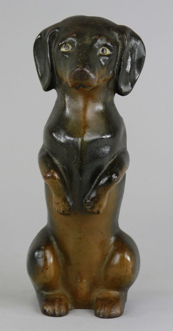 BEGGING DACHSHUND DOORSTOP: "Dick Bros, Inc., Reading, Penna.," wonderful detailed casting of popular breed, realistic black & tan paint, upright in an irresistible begging pose, rare. 10 7/8" x 4 1/4".