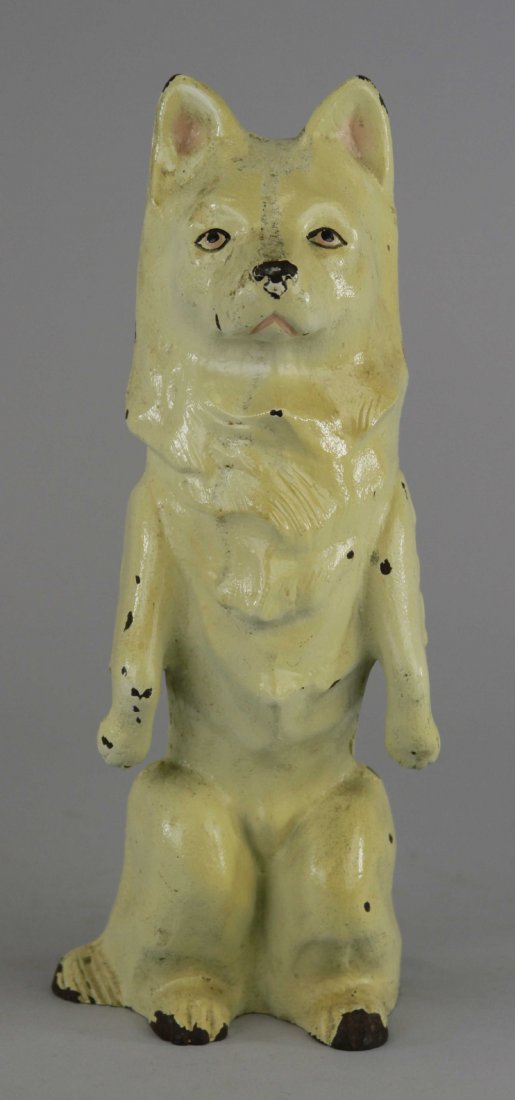 SITTING UP MALAMUTE DOORSTOP: Copyright 1930, Dick Bros., Inc., Reading, Penna., white malamute depicted sitting up on hind legs. 11 3/4" x 4 1/2".