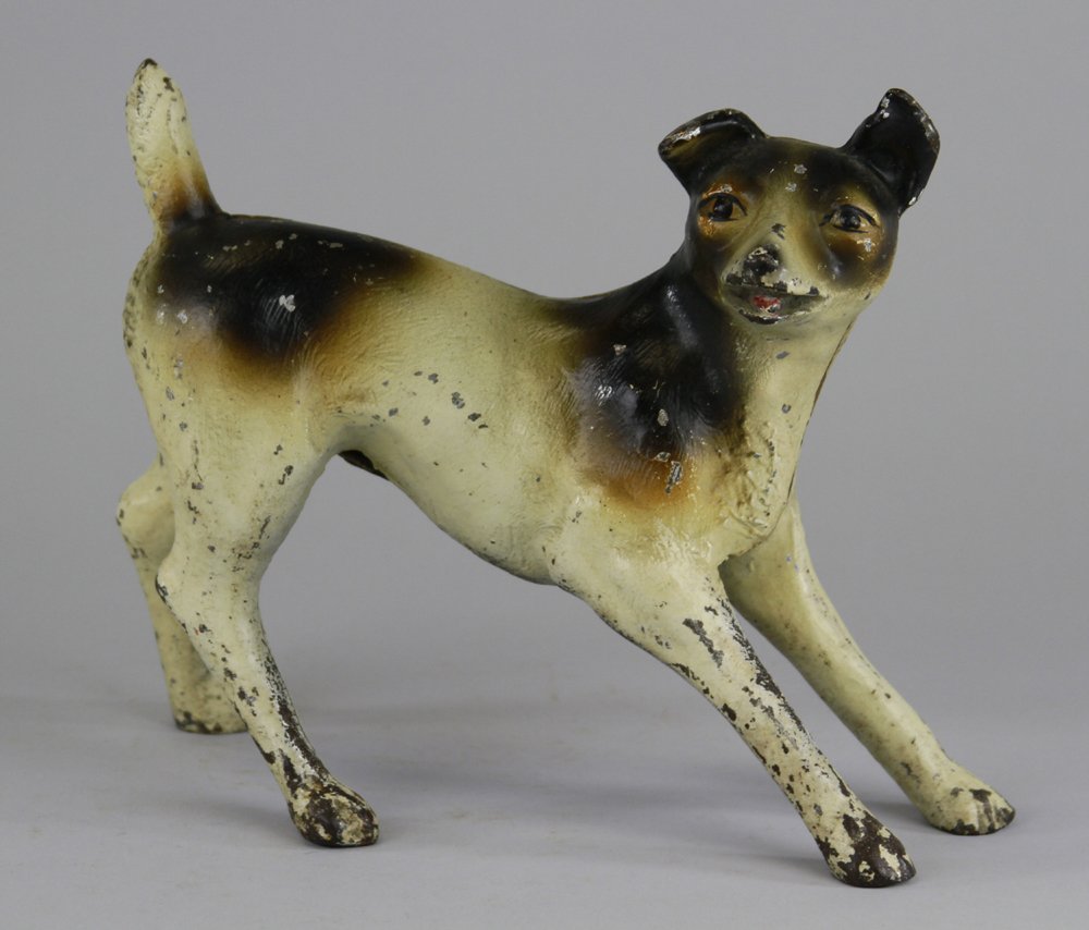 TERRIER DOORSTOP: Full figure, depicts terrier in spread stance as if ready to pounce, playful pose, rare. 7 7/8" x 9 3/4".