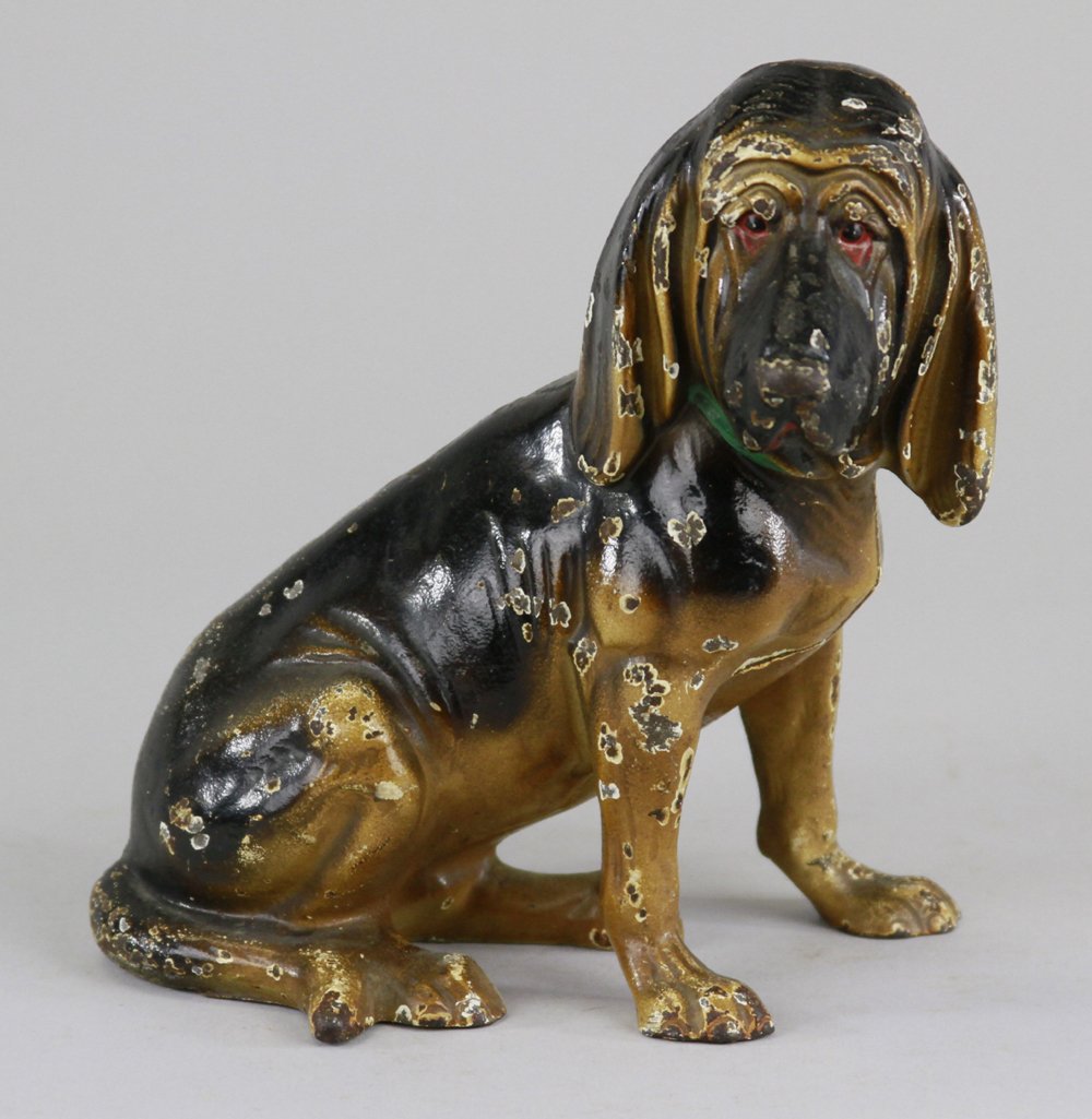 BLOODHOUND DOORSTOP: Full figure, Hubley, Cat. #387, rare, cast iron, painted in black & tan, endearing wrinkled face w/dropping ears, quite realistic in form with painted green collar, rare. 7" x 6 1/2".