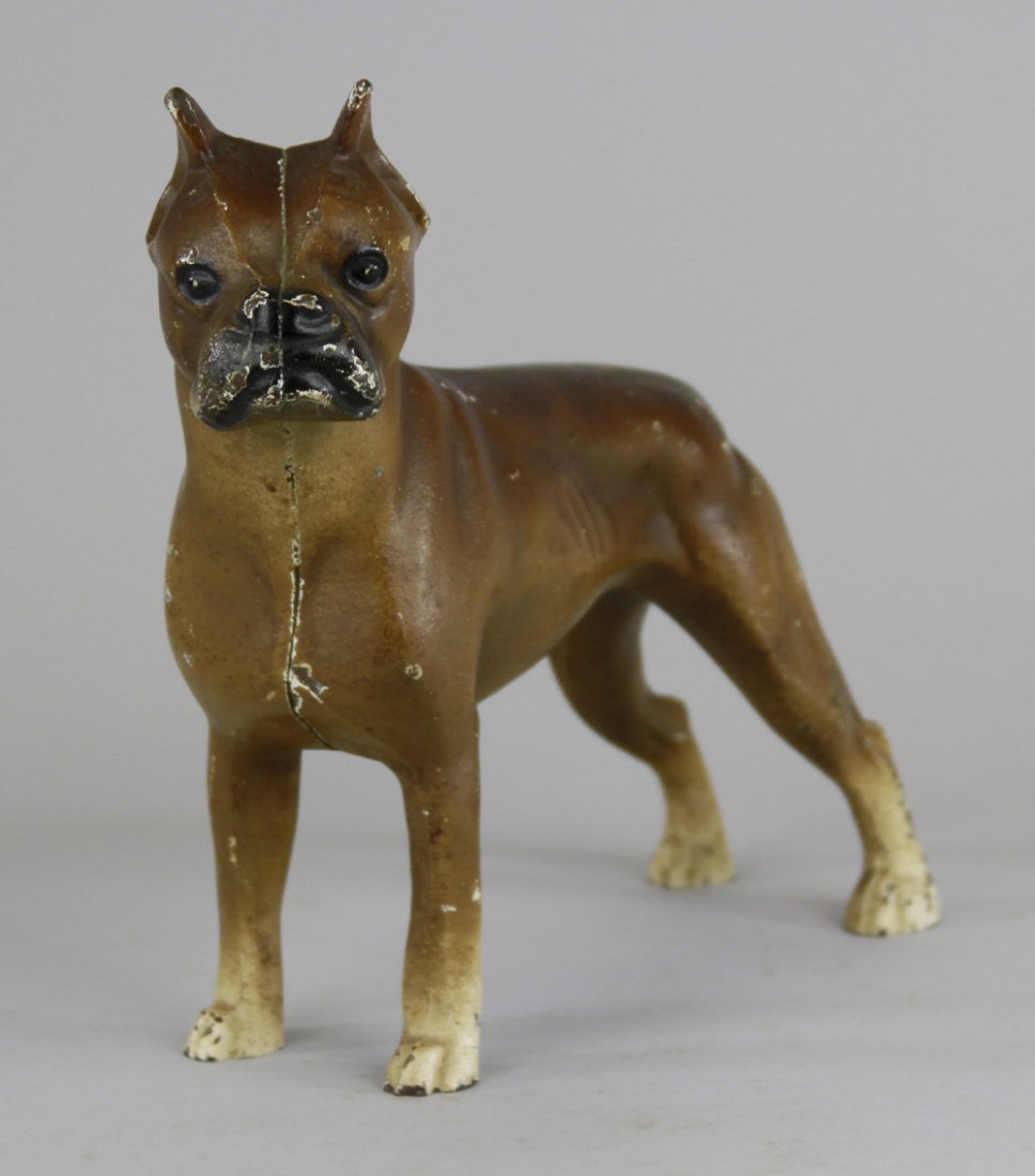 BOXER DOORSTOP: Hubley, full figure depiction of brown boxer w/cream paws, pointed ears and clipped tail. 9 1/2" x 8 1/2".
