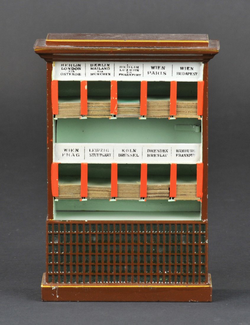 MARKLIN TICKET DISPENSER: Hand enameled tin, an exceptional example in unplayed with condition, retains numerous original tickets. 7 1/4" h.