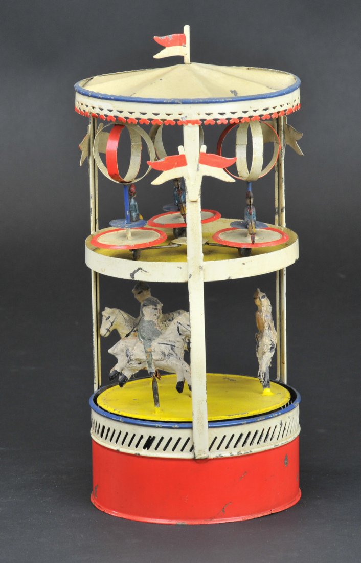DOUBLE TIER CAROUSEL: Germany, possibly Gunthermann, hand painted, upper tier features twirling chair rides, bottom tier contains carousel horses with figures, clockwork driven. 9 1/2" h.