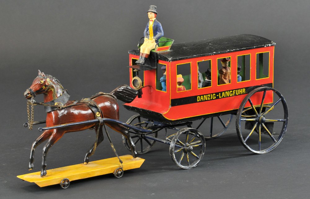 HORSE DRAWN TROLLEY: Lutz, Germany, c. 1870, hand painted tin trolley done in red body, black roof w/yellow trim, driver seated on roof mount solo seat, spoke wheels, trolley has steps leading to interior bench seating, s