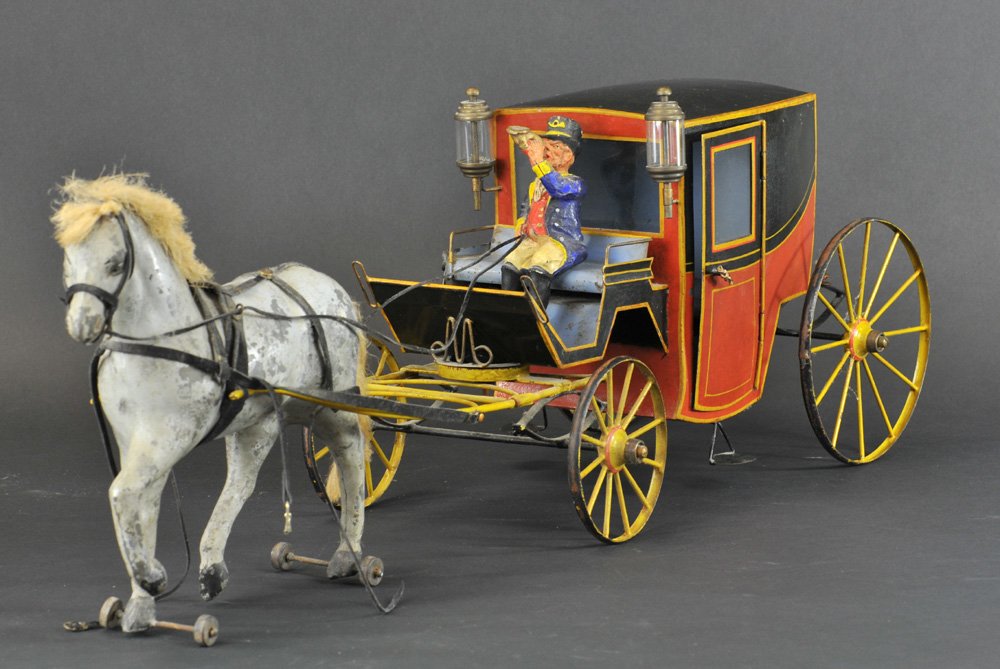 FRENCH HORSE DRAWN BROUGHAM: c. late 1890's, France, a popular mode of early transportation, tin plate example is painted in red & black coach body, yellow spoke wheels w/red striping, nice detail to yellow hitch, lamps on sides,
