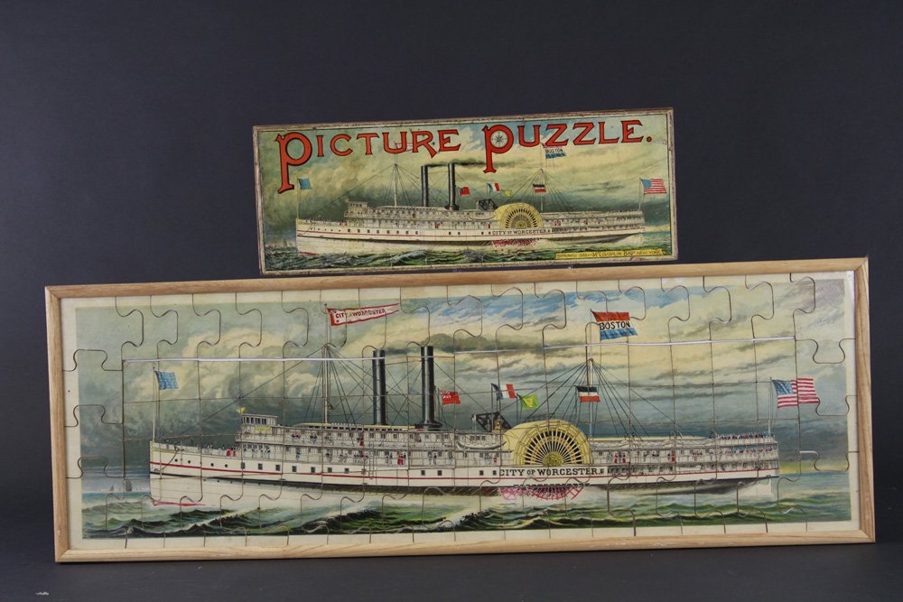 MCLOUGHLIN BROS. 1889 WORCHESTER PICTURE PUZZLE: City of Worchester, includes: original box, paddle wheeler is very detailed, graphics are extensive overall. Former Siegel Collection. 12" x 36".