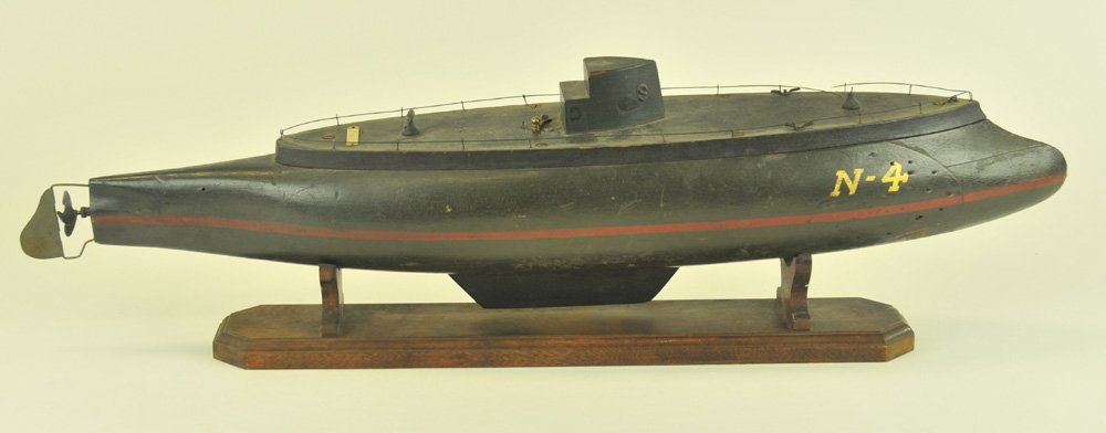 WOODEN SUBMARINE: Superior Toy Works of Cleveland, battery-operated, early example, heavy wood hull w/brass contact lever on deck, well scaled and designed, deck unscrews for battery placement. 28 1/2" l.