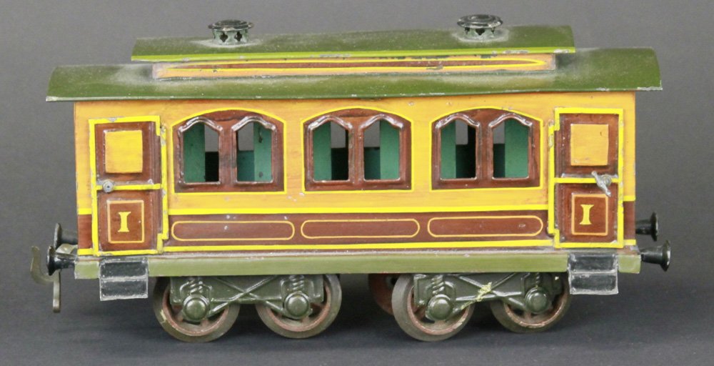 BING GAUGE 'I' SALON CAR: Germany, ornate body styling, early example, opening doors at both ends, interior shows green painted sitting booths, eight wheels. 10 1/2" l.