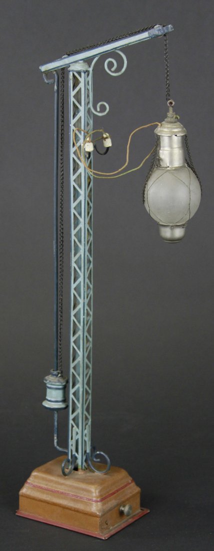 MARKLIN ARC LAMP: Germany pre-war, tin, c. 1904-1911, trestle tower, weight on back lifts for chain to drop lamp into position, electric wiring. 17" h.