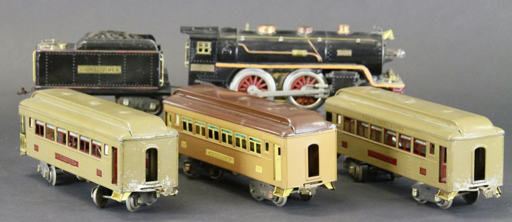 LIONEL 390E LOCOMOTIVE WITH PASSENGER TRAINS: 390E Locomotive and 390T Tender, together with two #309 Pullmans, one in Mojave and in tan & brown, and one #312 Observation Coach in Mojave. Loco 13 1/2" l.