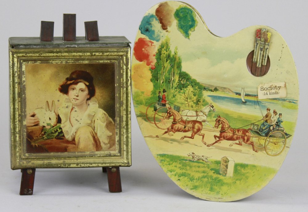 PAINTINGS ON EASEL & ARTISTS PALETTE BISCUIT TINS: England, colorful Palette box w/embossed paint brushes, together with two-sided paint easel display box on stand. 5 1/2" - 7 1/2" w.