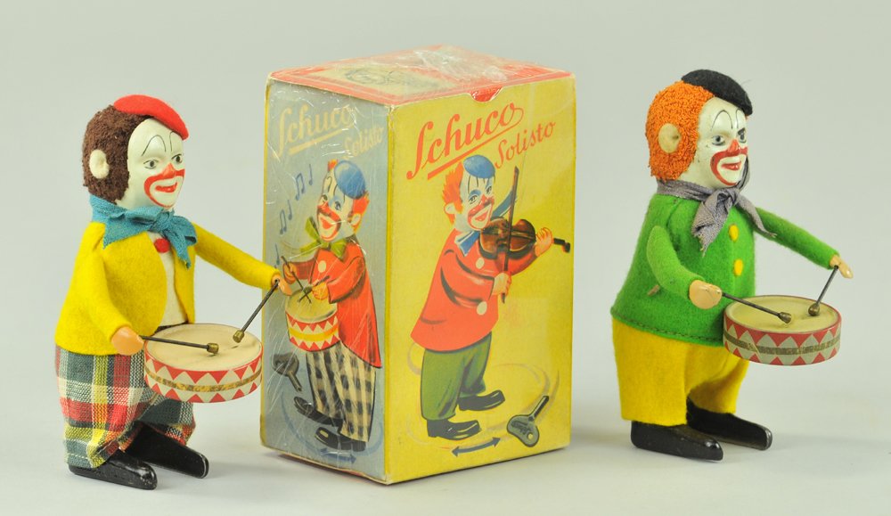 LOT OF TWO SCHUCO MUSICIANS: Colorful clown group includes two parade drummers (one boxed,) both able to wobble along while playing instruments. 4 1/2" h.