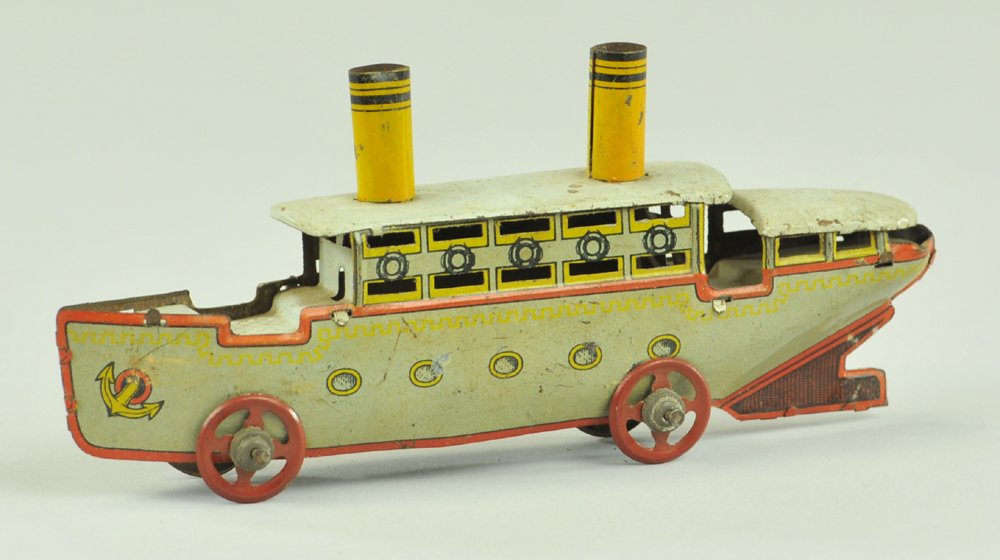 OCEAN LINER PENNY TOY: Lithographed tin, features two yellow stacks, upper deck cabin, anchor graphics on hull. 6" l.