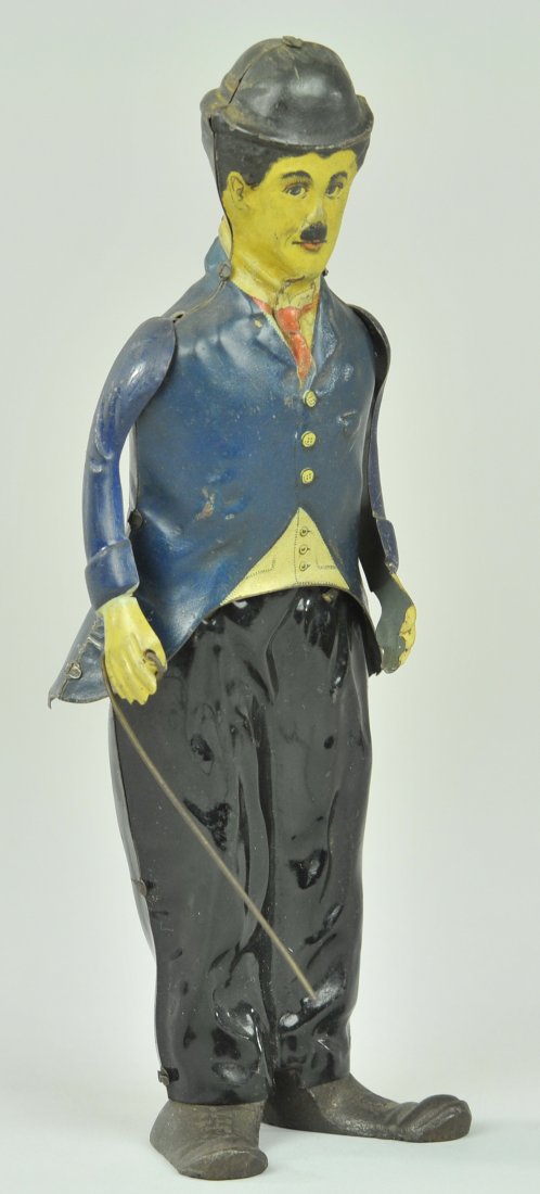 CHARLIE CHAPLIN WALKER: B & R, U.S.A., lithographed tin Charlie Chaplin, toy has clockwork action allowing comical side to side action, Charlie depicted in familiar outfit with top hat and cane in hand. 8 1/2" h.