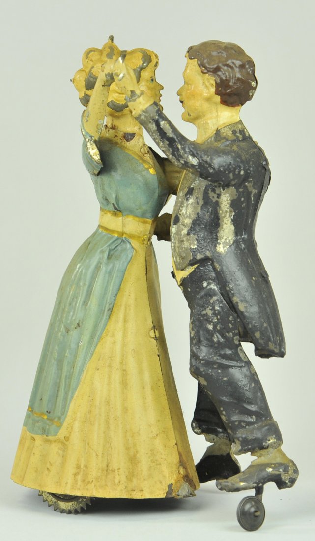 TANGO DANCERS: Gunthermann, Germany, hand painted tin, depicts couple dancing the classic tango, clockwork driven. 8" h.