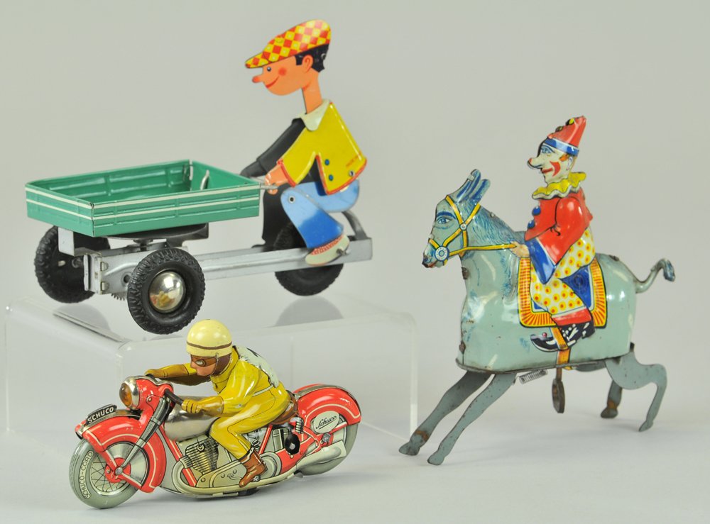 GROUPING OF GERMAN TIN TOYS: Lot includes Schuco Moto-Drill 1006 Motorcycle with driver, Gunthermann clown riding donkey wind-up toy, and boy pedaling open delivery cart made in Western Germany, all tin lithographed. 4 1/2" - 5 1