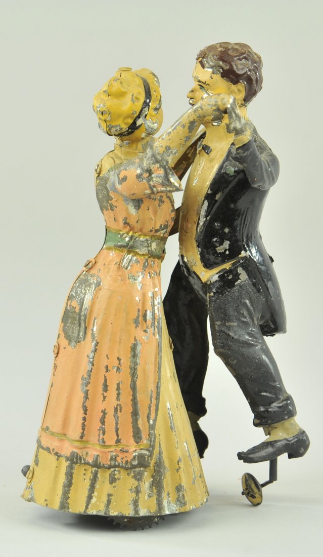 TANGO DANCERS: Gunthermann, Germany, hand painted tin, depicts couple dancing the classic tango, clockwork driven. 8" h.