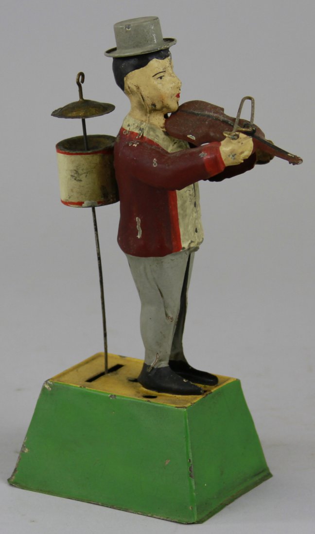 GUNTHERMANN ONE-MAN BAND MUSICIAN: Germany, whimsical depiction of standing figure, holding violin and bow in hand while drum w/cymbal are attached to back of figure, both able to emit sounds when clockwork is activated, great action. 