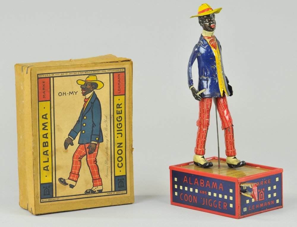 OH MY ALABAMA COON JIGGER: Lehmann, lithographed tin, dancing figure on tin dance floor base, clockwork, original box. 10" h.