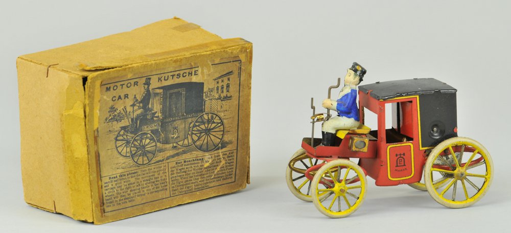 LEHMANN BOXED MOTOR CAR: Germany, lithographed tin, one of the first Lehmann toy autos, an obvious horseless carriage converted to motorized power, seated driver, enclosed coach, spoke wheels, done in bright red and black bod