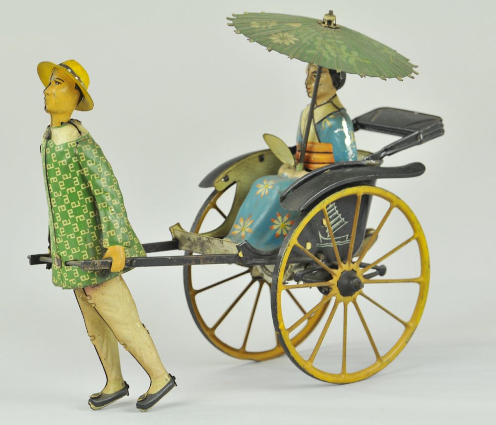 LEHMANN MASUYAMA: Germany, lithographed and hand painted tin, attractive toy features Asian Lady in rickshaw w/floral designed parasol, clockwork mechanism. 6 3/4" l.