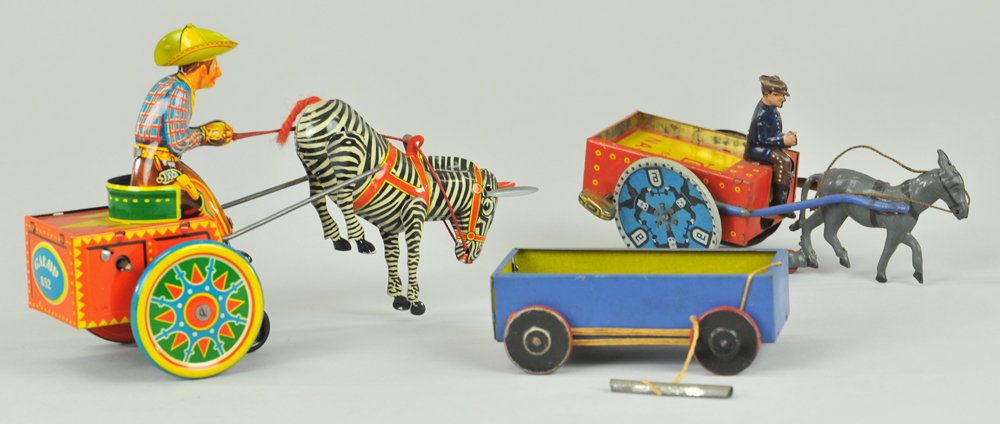 LOT OF THREE LEHMANN TOYS: Lithographed tin grouping, includes: BiBi Cart, NA-OB man in donkey cart, and Galop, Zebra drawn cart. 4" - 7 1/4" l.