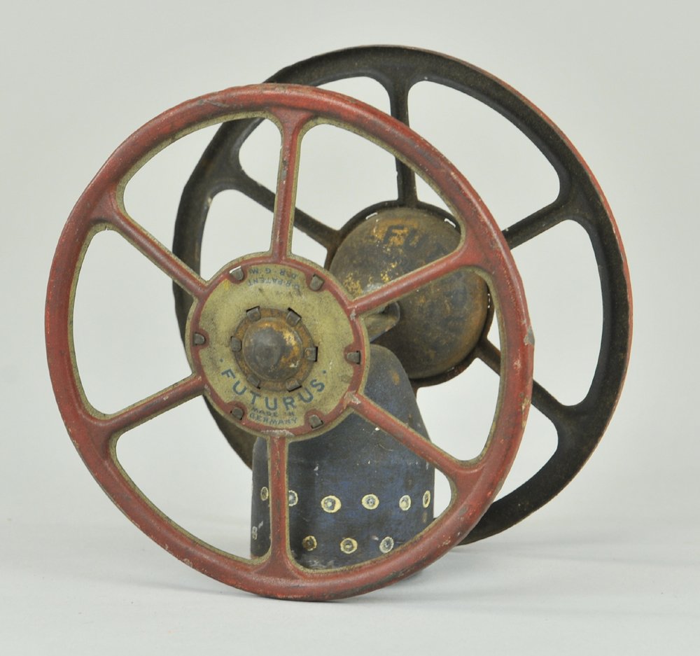 LEHMANN FUTURUS PEACE CHIME: Germany, steel cased shell from the scrap yards of World War I, Lehmann gesture of no more war, housed in familiar zig zag spoke wheels, , but peace in the future, interior gold hubs marked, "Futurus.