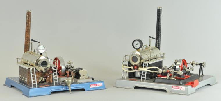 TWO WILESCO STEAM ENGINES: West Germany, extensive appointments, horizontal boilers mounted on brickwork supports, each with nickel flywheel, ladders to catwalks and all necessary gauges, smoke stacks are embossed, one includes