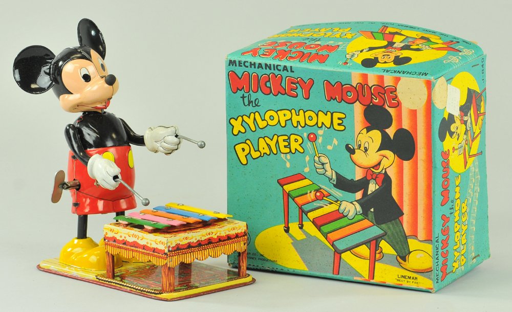 MICKEY MOUSE XYLOPHONE PLAYER WITH BOX: Linemar, Japan, Copr. Walt Disney Productions, lithographed tin, depicts Mickey drumming the key when key wind is operated, nice graphics. 6" h.