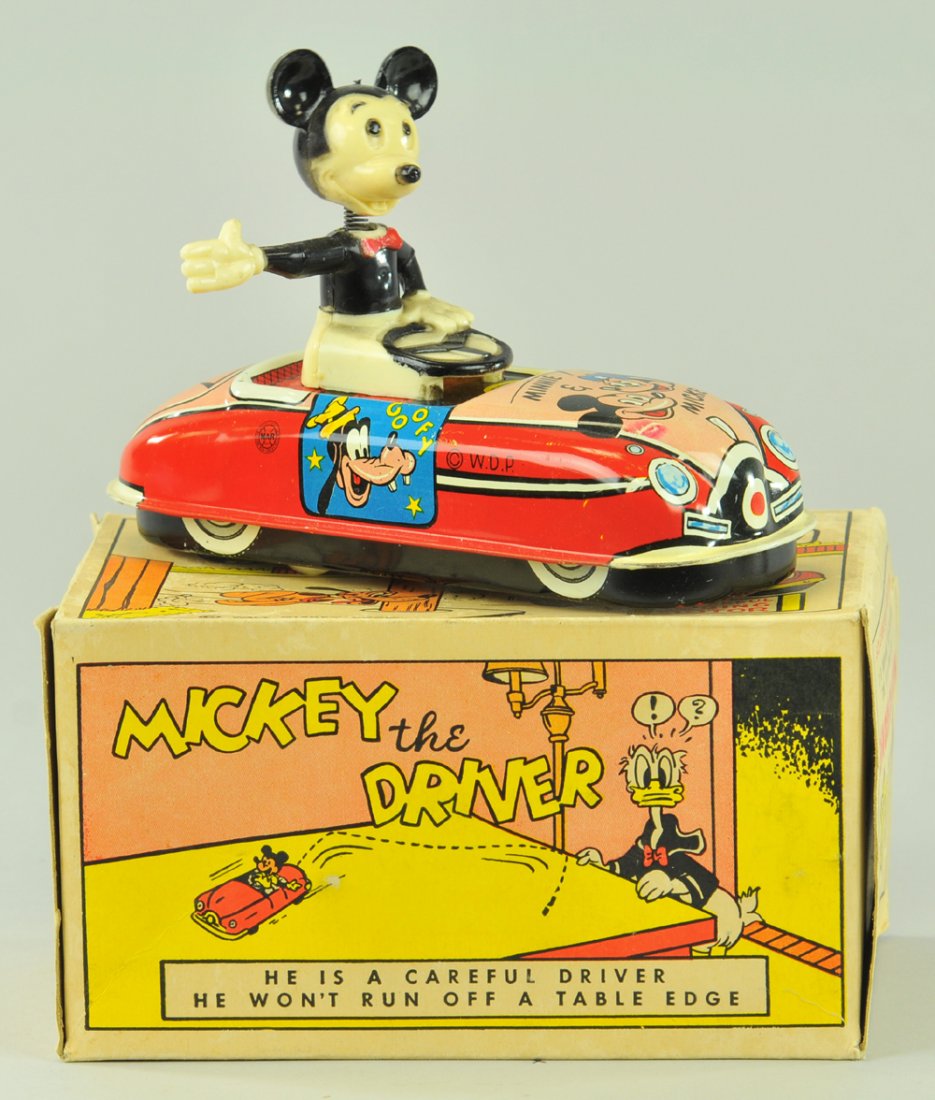 MARX MICKEY MOUSE THE DRIVER IN ORIGINAL BOX: Litho tin wind-up toy with plastic Mickey driver, working, Copr. Walt Disney Productions, Mickey's head on spring bobs wildly with crazy car action. 6 3/4" l.