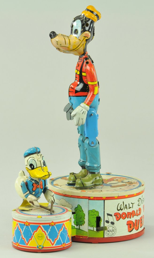 DONALD DUCK DUET: Louis Marx, 1945, large Goofy & small Donald, lithographed tin, both depicted standing on large bass drums, clockwork activated. 9 3/4" h.