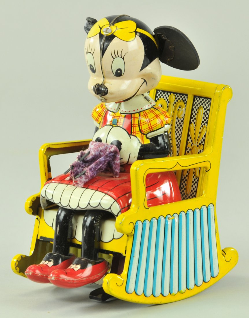 MINNIE MOUSE KNITTER: Linemar, Japan, lithographed tin, amusing depiction of Minnie seated in rocking chair while knitting. 6 1/2" h.