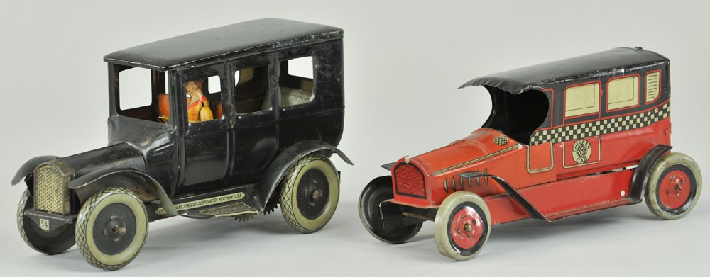 STRAUSS FLIVVER & CHEIN CHECKER CAB: Lithographed tin, sedan model done in black, spare on rear, seated tin litho driver, wind-up action, cab is a colorful litho tin floor toy example. 6 1/2" l.