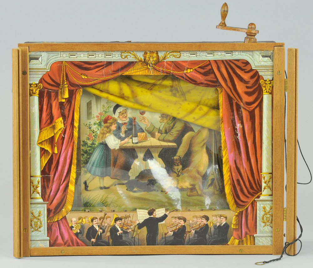 TOY STAGE: Great imagery with full orchestra graphics at front, stage boxed set, features changeable back drop scenery rolls behind plastic front piece, stage border done in cardboard. 12 1/2" h. x 15 1/2" w.