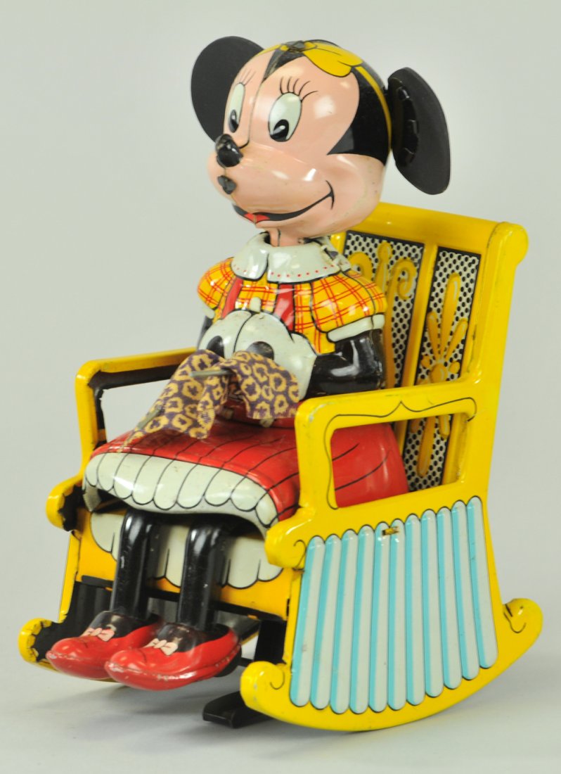 MINNIE MOUSE KNITTER: Linemar, Japan, lithographed tin, amusing depiction of Minnie seated in rocking chair while knitting. 6 1/2" h.