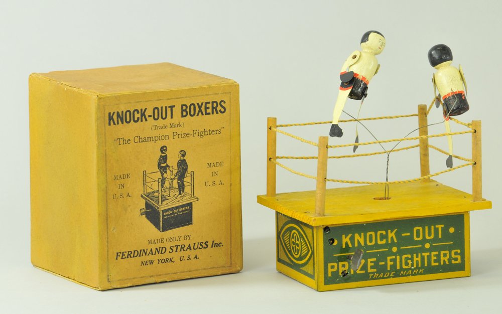 KNOCKOUT BOXERS WITH BOX: Ferdinand Strauss, litho boxing ring with wood floor and ring poles, two figures at center done in wood and supported by thin wire, billed as the Champion Prizefighters, key wind operated. 7 3/4" h.