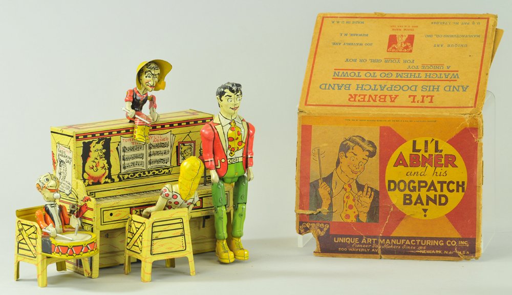 LIL ABNER BAND: Unique Art, lithographed tin, a classic mechanical comic band toy featuring four members of the Dogpatch Band, colorful and amusing. 9" w.