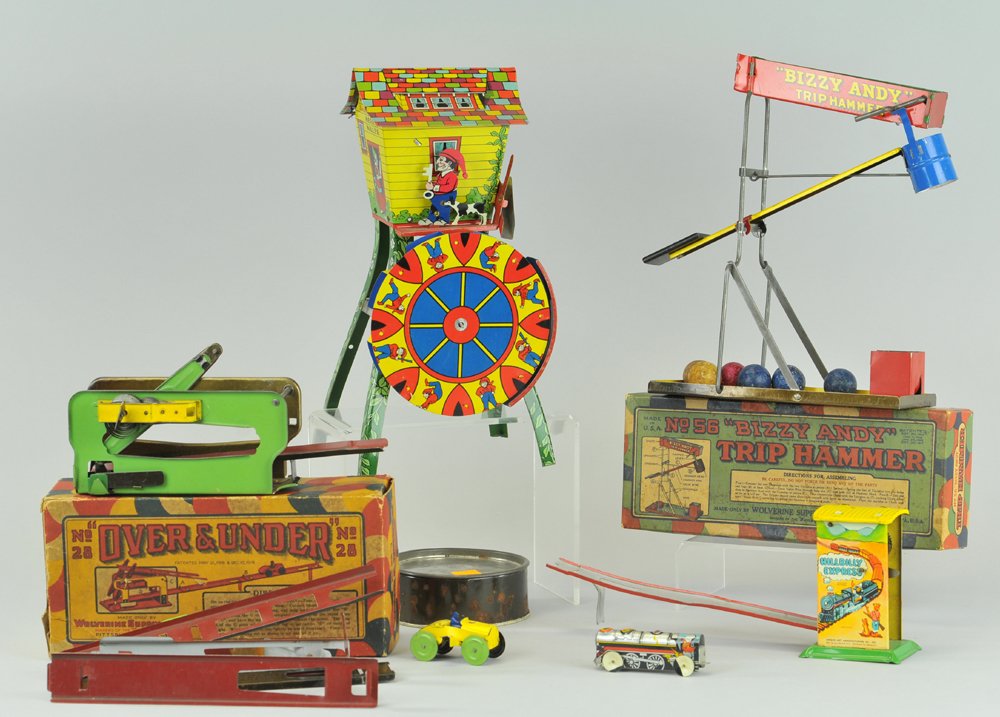LOT OF THREE TIN TOYS: Grouping includes: boxed Wolverine "Bizzy Andy" Trip Hammer, "Over & Under" Car Ramp toy, "Sandy Andy," "Merry Miller Sand" toy, and small "Hill Billy Express" toy. 10 1/2" - 12 1/2" h.