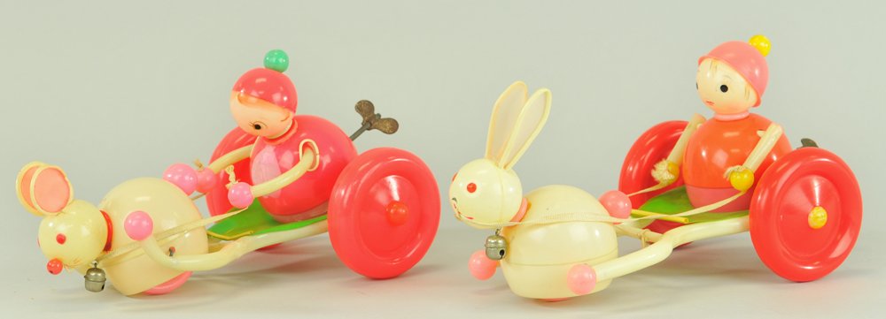 LOT OF TWO CELLULOID ANIMAL DRAWN CHARIOTS: Japan, both very colorful and key wind driven, features two Rabbits, different ear designs, these were part of a series, very elusive examples. 8 1/2" l.