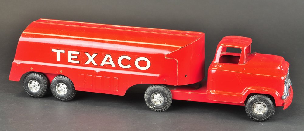 BUDDY 'L' TEXACO TRUCK: Pressed steel, tandem w/tanker, decals on body, rubber tires, painted bright red overall, just like the real road trucks of its day. 23 1/2" l.